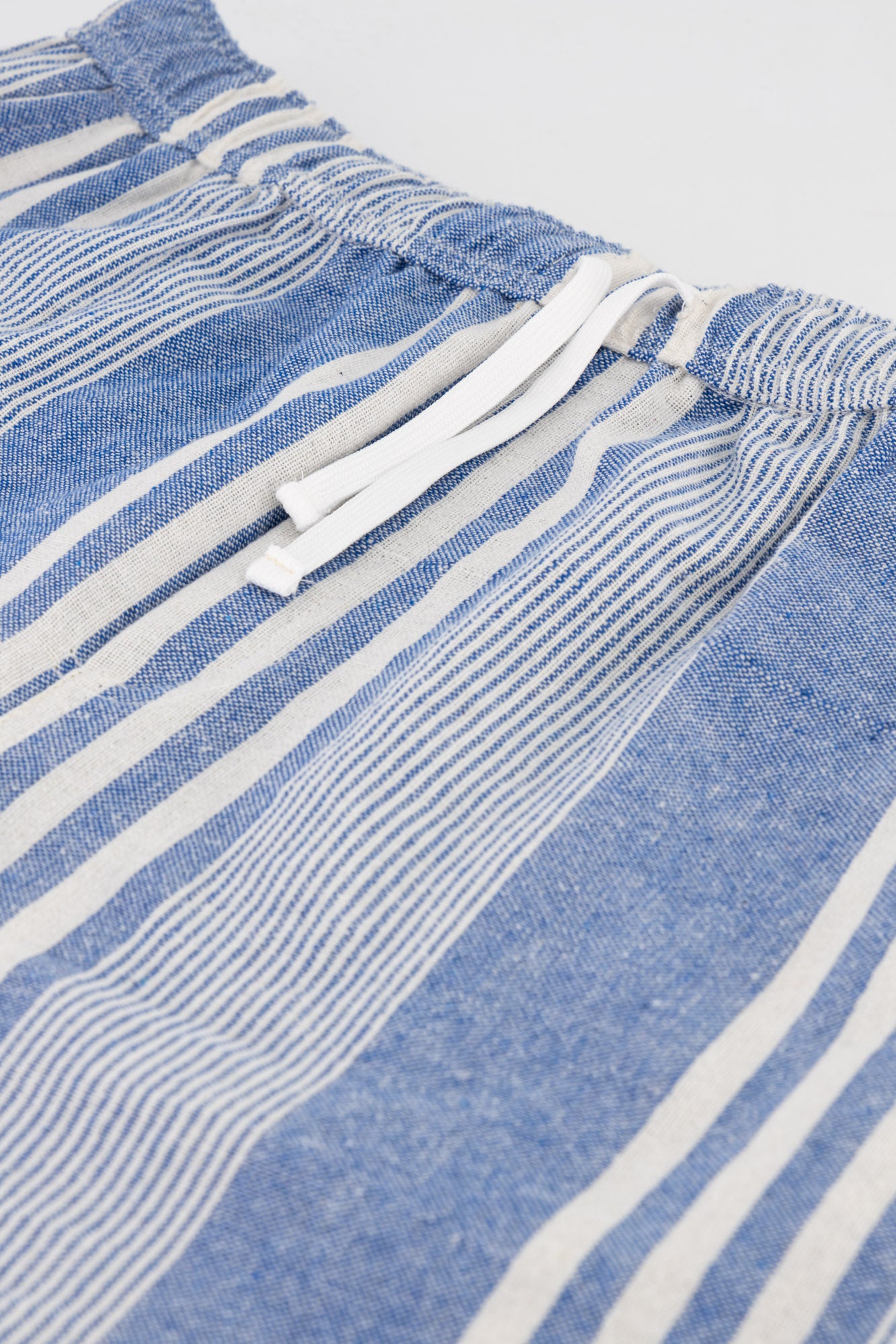 Flat-lay detail shot of Blue Striped Cotton Kikoi Shorts