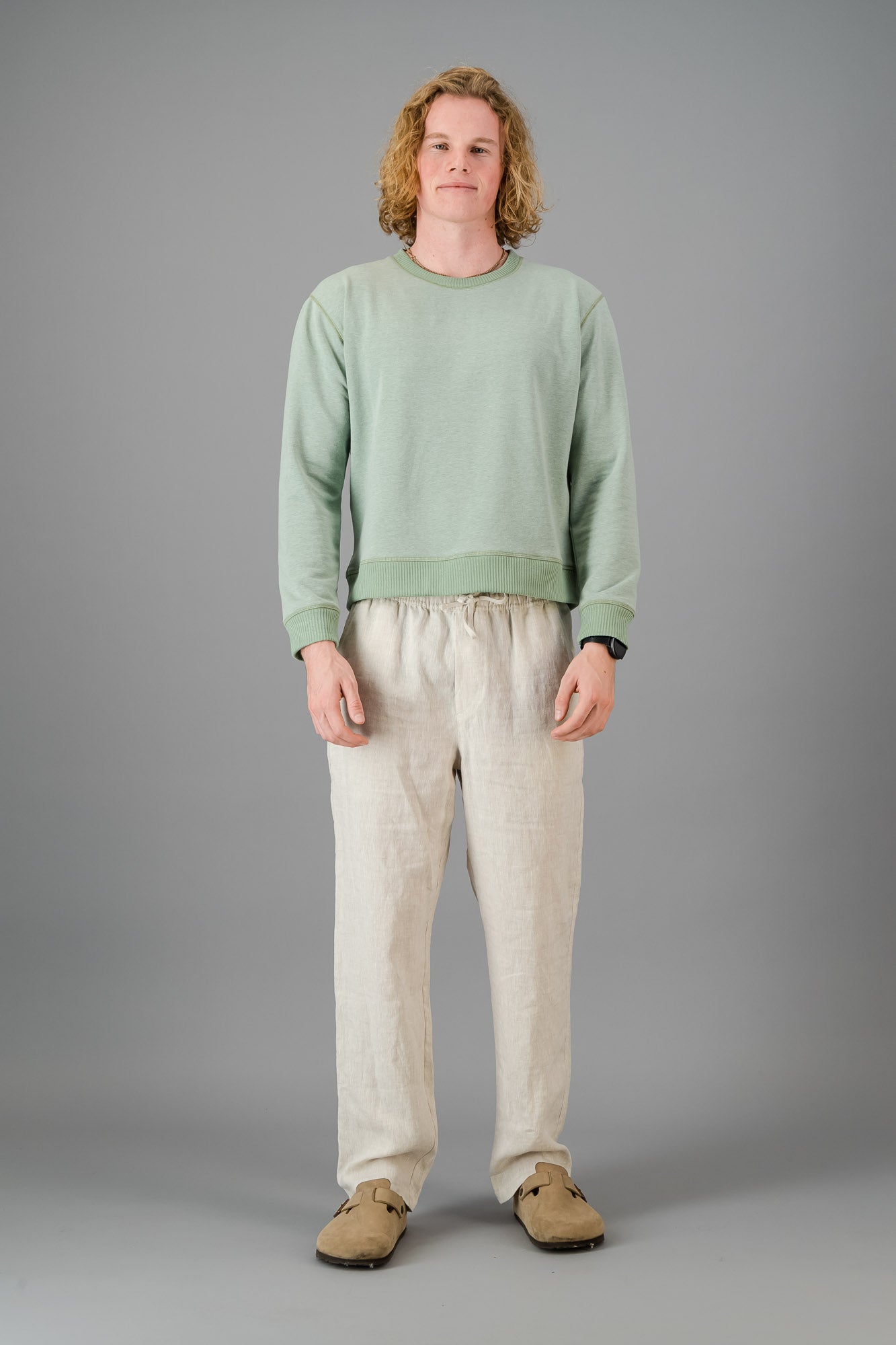 Model wearing Cotton Sweater Sage Green (Cut-Off).