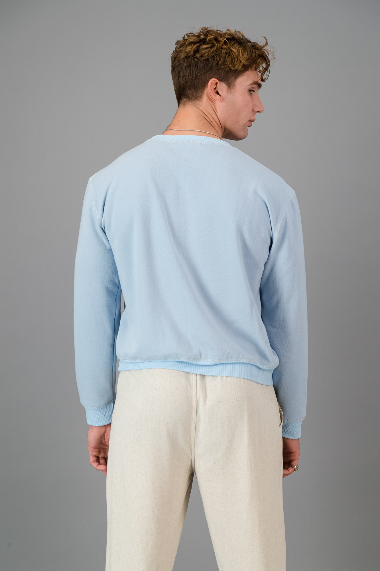 Model wearing Sky Blue Cotton Sweater (Cut-Off).