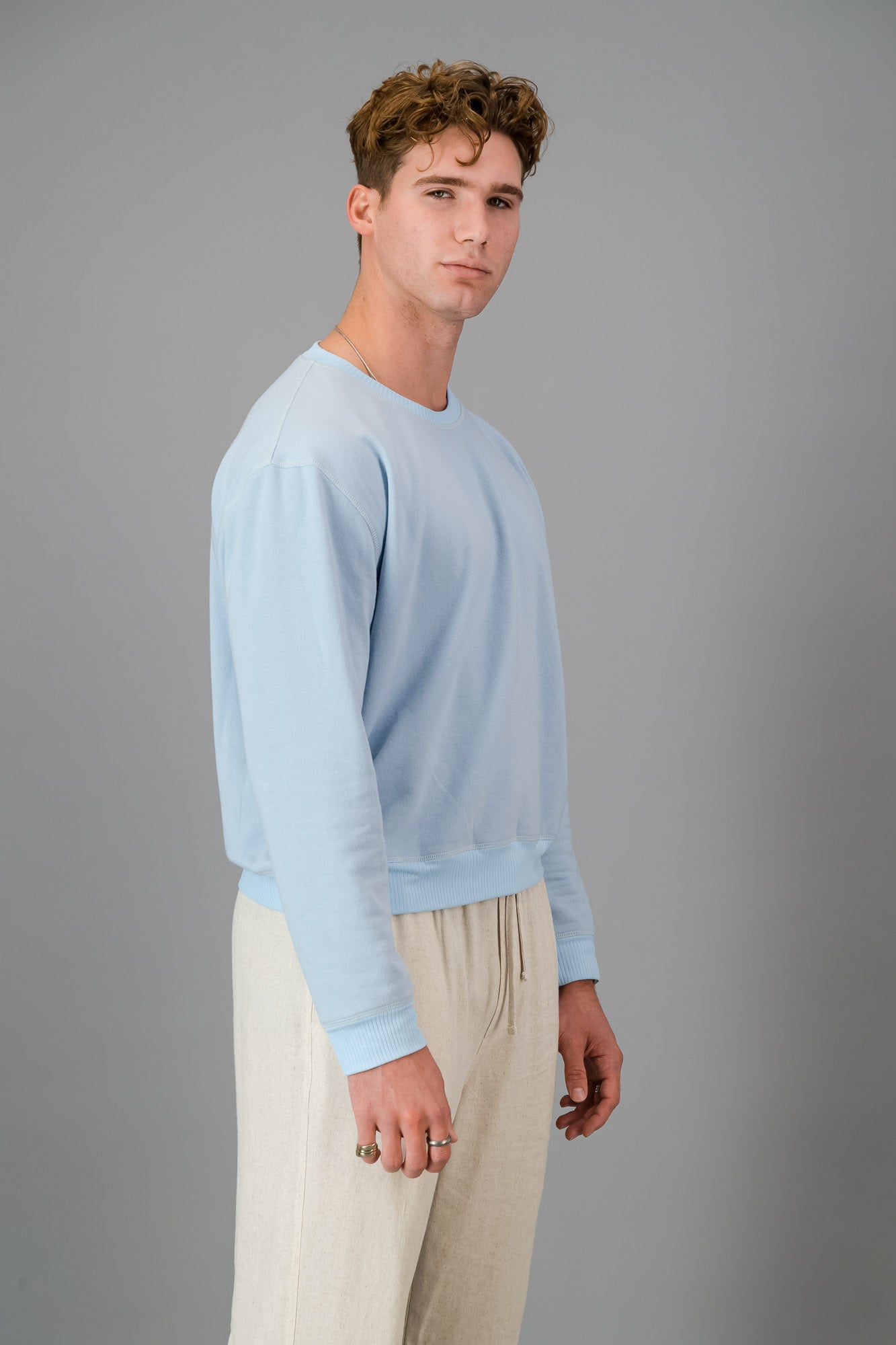 Model wearing Sky Blue Cotton Sweater (Cut-Off).